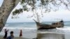 A wooden boat that carried Rohingya refugees rests at a beach in Ladong village, Indonesia, Dec. 25, 2022, in this photo taken by Antara Foto. 