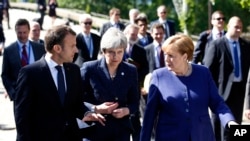 Francuski predsednik Emanuel Makron, britanska premijerka Tereza Mej i nemačka kancelarka Angela Merkel na marginama samita