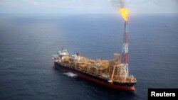 FILE - The Kaombo Norte floating oil platform is seen from a helicopter off the coast of Angola, Nov. 8, 2018.