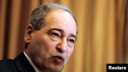 Wakil Menteri Luar Negeri Suriah Faisal al-Mekdad dalam konferensi pers di Damascus, Suriah, 10 Maret 2018. Al-Mekdad baru diangkat menjadi Menteri Luar Negeri menggantikan Walid Moalem yang wafat pekan lalu.