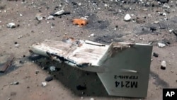 FILE – This undated photograph released by the Ukrainian military shows the wreckage of a Russian-fired Shahed drone that it said was downed near Kupiansk, Ukraine.