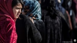 A young Iraqi girl at a camp outside Kirkuk for civilians displaced by the conflict against Islamic State. Photograph by Bertalan Feher, 2016.