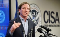 FILE - U.S. Cybersecurity and Infrastructure Security Agency (CISA) Director Christopher Krebs speaks to reporters at CISA’s Election Day Operation Center on Super Tuesday in Arlington, Virginia, March 3, 2020.