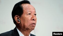 FILE - General Tea Banh, Cambodia's Defense Minister, waits for his turn to speak at 11th International Institute of Strategic Studies Asia Security Summit, in Singapore, June 2012.