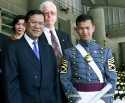 FILE- Cambodia's Prime Minister Hun Sen (L) stands with his son Hun Manet after graduation ceremonies at the United States Military Academy at West Point, May 29. Hun Sen's son, was one of the 934 cadets to graduate. (Reuters)