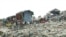 Shelters are seen amid mounds of trash at Dangkor Landfill, in Phnom Penh, Cambodia, Dec. 31, 2019. (Tum Malis/VOA Khmer)