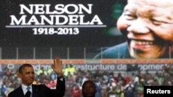 U.S. President Barack Obama addresses the crowd during a memorial service for Nelson Mandela at FNB Stadium in Johannesburg, Dec. 10, 2013. 