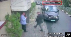 FILE _ This image taken from CCTV video obtained by the Turkish newspaper Hurriyet and made available on Oct. 9, 2018 claims to show Saudi journalist Jamal Khashoggi entering the Saudi consulate in Istanbul, Oct. 2, 2018.