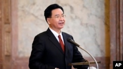 FILE - Taiwan Foreign Minister Joseph Wu holds a speech during his visit to Czech Senate in Prague, Czech Republic, Oct. 27, 2021.