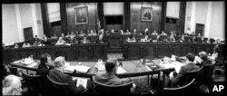 FILE - This was the scene in the hearing room of the House Judiciary Committee in Washington, July 25, 1974, as the panel began another day of debate on the question of impeaching President Richard Nixon.
