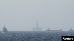 FILE - An oil rig (C) which China calls Haiyang Shiyou 981, and Vietnam refers to as Hai Duong 981, is seen in the South China Sea, off the shore of Vietnam in this May 14, 2014 photo.