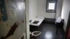 FILE - A Jan. 28, 2016, photo shows a solitary confinement cell known as "the bing," at New York's Rikers Island jail.
