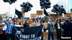FILE - Myanmar press freedom advocates and youth activists hold a demonstration demanding the freedom of two jailed Reuters journalists Wa Lone and Kyaw Soe Oo in Yangon, Myanmar, Sept. 16, 2018. 