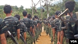 FILE - Arakan Army recruits scale the climbing ropes at the Laiza, Kachin State base camp, in this undated photo. Both the rebel group and the Myanmar military have been accused of forcibly conscripting Rohingya men.