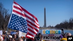 Demonstrators gather for the Stand Up For Science rally near the Lincoln Memorial, March 7, 2025, in Washington. 