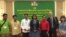 Veena Reddy, USAID mission director, and Matthew Edwardsen, USAID Green Prey Lang Project​ party chief are pictured with five other activists in Phnom Penh, Cambodia, April 3, 2019. (Tum Malis/VOA Khmer) 