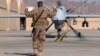 A U.S. airman guides a U.S. Air Force MQ-9 Reaper drone as it taxis to the runway at Kandahar Airfield, Afghanistan, March 9, 2016. 