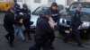 Crnogorska policija privodi osumnjičene na saslušanje u izbornom danu, 16. oktobra 2016. (AP Photo/Darko Vojinovic)