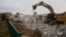 Bulldozers demolish houses in the West Bank settlement of Ofra, March 1, 2017. 