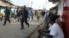 Liberian security forces patrol a street after clashes at West Point neighborhood in Monrovia, Aug. 20, 2014.