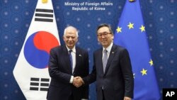 South Korean Foreign Minister Cho Tae-yul, right, shakes hands with European Union foreign policy chief Josep Borrell, at the Foreign Ministry in Seoul, South Korea, Nov. 4, 2024.