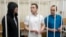 FILE - Lawyers Igor Sergunin, from left, Alexei Liptser and Vadim Kobzev, all who once represented late opposition leader Alexei Navalny, stand in a courtroom in Petushki, Vladimir region, east of Moscow, Jan. 17, 2025.