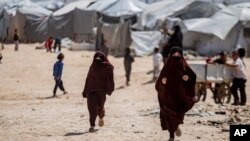 FILE - Children run in al-Hol camp, which houses families of members of the Islamic State group in Hasakeh province, Syria, April 19, 2023.