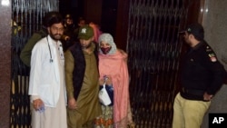 Passengers rescued by security forces from a passenger train attacked by insurgents arrive at a railway station in Quetta, Pakistan, March 12, 2025.