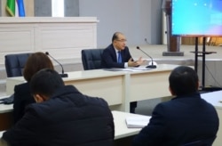 Asadjon Khodjaev, head of the Agency of Informaton and Mass Communications, talks to reporters, in Tashkent, Uzbekistan, Nov. 11, 2020. (Photo courtesy of aoka.uz)