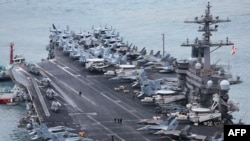 The USS Carl Vinson, a US nuclear-powered aircraft carrier, arrives at a South Korean naval base during its port visit in the southeastern port city of Busan on March 2, 2025. 