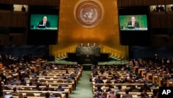 U.N. Secretary-General Ban Ki-moon speaks as President of the 71st session of the General Assembly Peter Thomson (C), and Mogens Lykketoft, President of the 70th session of the General Assembly look on during the opening of a summit on refugees and migrants, Sept. 19, 2016, at U.N. headquarters, New York.