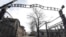 FILE - The entrance gate is seen at the Auschwitz-Birkenau Nazi concentration camp in Oswiecim, Poland, Feb. 15, 2019. The sign above the gate reads in German "Work liberates."