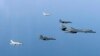 In this photo provided by South Korean Defense Ministry, a U.S. Air Force B-1B bomber, right, and South Korean fighter jets conduct a joint training exercises over the Korean Peninsula Wednesday, March 22, 2017. North Korea's latest missile launch ended in failure on Wednesday as the United States sent a supersonic bomber streaking over ally South Korea in a show of force against the North, officials said. (South Korean Defense Ministry via AP)