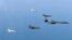 In this photo provided by South Korean Defense Ministry, a U.S. Air Force B-1B bomber, right, and South Korean fighter jets conduct a joint training exercises over the Korean Peninsula Wednesday, March 22, 2017. North Korea's latest missile launch ended in failure on Wednesday as the United States sent a supersonic bomber streaking over ally South Korea in a show of force against the North, officials said. (South Korean Defense Ministry via AP)