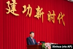 资料照：中国领导人习近平在全国政协新年茶话会上发表讲话。（2021年12月31日）