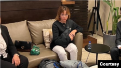 FILE - In an undated photo, Fawzia Amin Saydo sits at the Iraqi Embassy in Amman, Jordan, waiting to be returned to Iraq after she was received by U.S. and Jordanian officials. She has since been relocated to Germany. (Courtesy of Salwan Sinjaree)