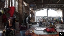 ယူနန်ပြည်နယ်အတွင်း ဒုက္ခသည်စခန်းမှ ကချင်စစ်ပြေးဒုက္ခသည်များ။