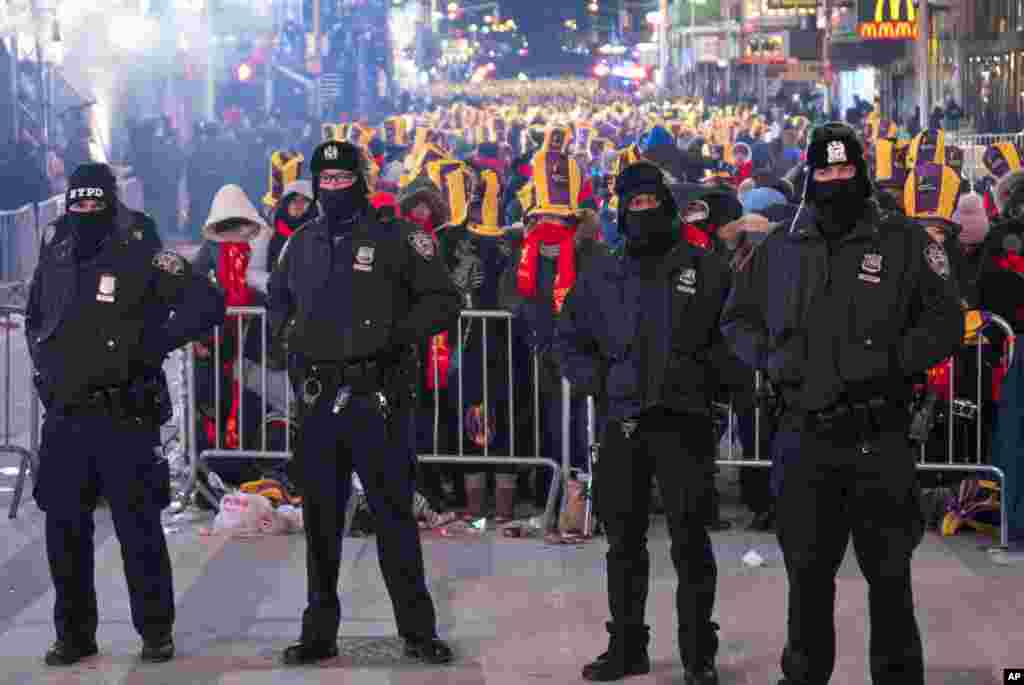 New York City police officers are seen on Times Square in New York, Dec. 31, 2017, during a New Year's Eve celebration.