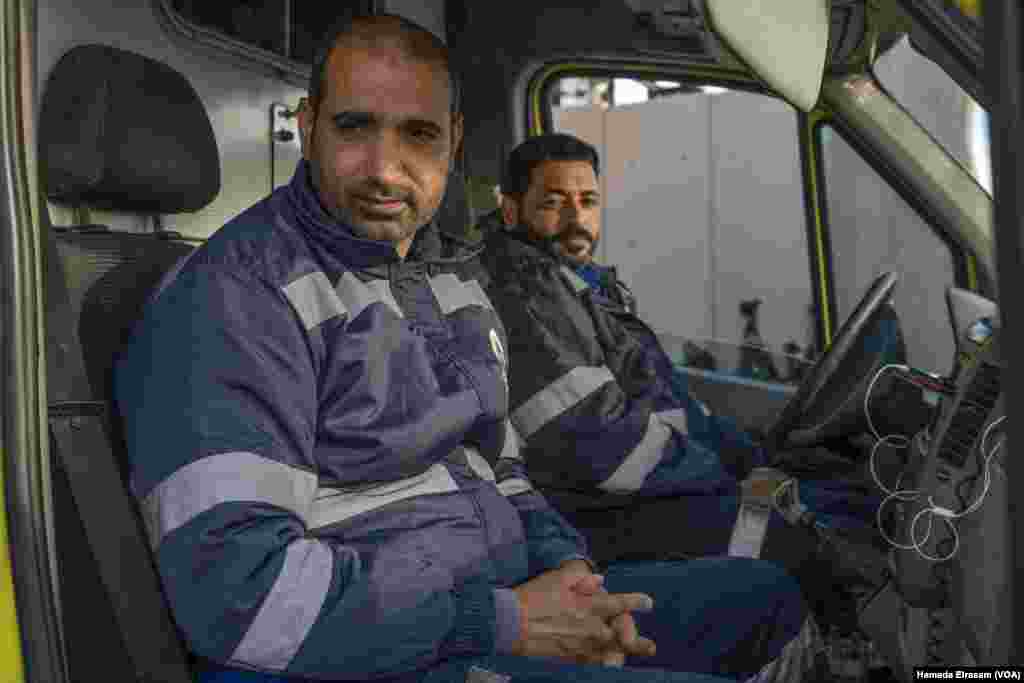 Egyptian paramedics Bahgat, left, and Hany haven’t treated war wounds since Israel shut the Rafah crossing in Gaza in May. “There aren’t signs of casualties coming to Egypt today, but we must stay ready,” says Bahgat. 