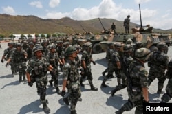 China's army soldiers attend the opening of military exercise in Kampong Speu province, Cambodia, March 17, 2018.