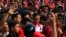 Supporters surround Jakarta governor and presidential candidate Joko Widodo (C) during a PDI-P party campaign in Cilegon, Banten province, March 28, 2014.