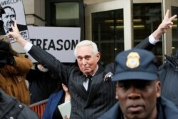 FILE -- Roger Stone, longtime political ally of President Donald Trump, flashes a victory gesture as he departs U.S. District Court in Washington, February 1, 2019.