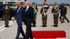 President Donald Trump walks with Belgian Prime Minister Charles Michel during an arrival ceremony at Brussels International Airport, May 24, 2017, in Brussels. 