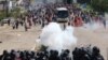 FILE - Riot police battle protesters teachers who blocked a federal highway in the Mexican state of Oaxaca, near the town of Nochixtlan, June 19, 2016.