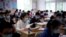 Students wearing face masks are seen inside a classroom during a government-organised media tour at a high school as more students returned to campus following the coronavirus disease (COVID-19) outbreak, in Shanghai, China May 7, 2020. REUTERS/Aly Song
