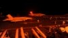 Chiến đấu cơ F/A-18 Super Hornet chuẩn bị cất cánh từ boong tàu bay của tàu sân bay USS George HW Bush (CVN 77) để thực hiện nhiệm vụ tấn công các mục tiêu IS ở Syria.