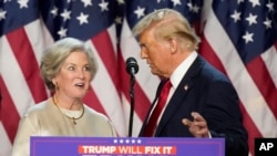 FILE - Donald Trump brings Susie Wiles to the podium at an election night watch party, Nov. 6, 2024, in West Palm Beach, Fla. The president-elect has chosen Wiles as his White House chief of staff. 