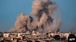 资料照片：以色列轰炸加沙南部城市汗尤尼斯。（2024年2月22日）