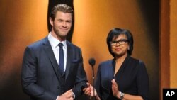 From left, Chris Hemsworth and President of the Academy Cheryl Boone Isaacs announce the Academy Awards nominations at the 86th Academy Awards nomination ceremony, Jan. 16, 2013 in Beverly Hills, Calif.