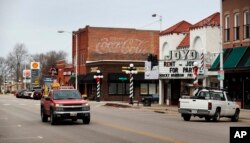 A driver in a pickup truck makes his way past businesses in Lincoln, Nebraska, Jan. 4, 2017.